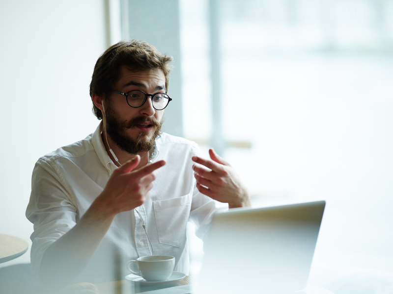 person giving presentation online on laptop