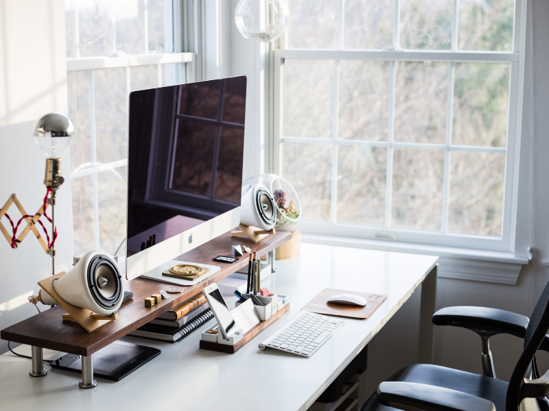 a neat work desk with computer parts and other related accessories